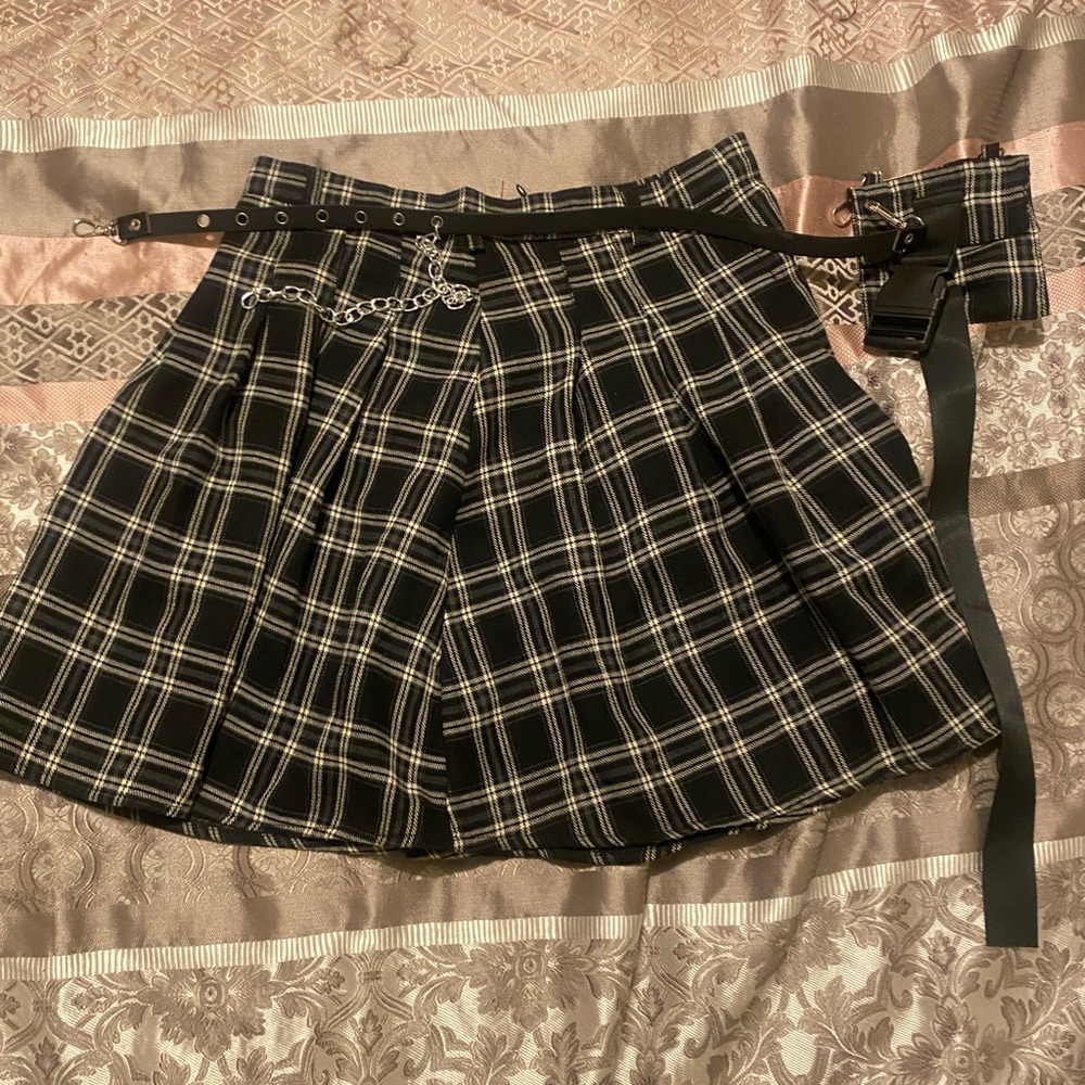 Black and grey plaid skirt with pocket holder and belt.